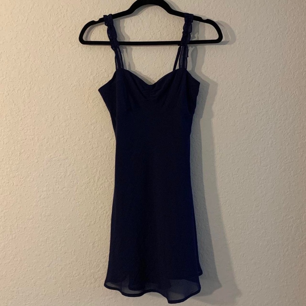 Urban Outfitters navy blue slip dress with
ruffled sleeves